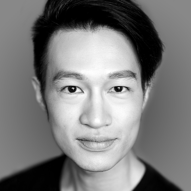 Black and white head shot of actor Joshua Lim